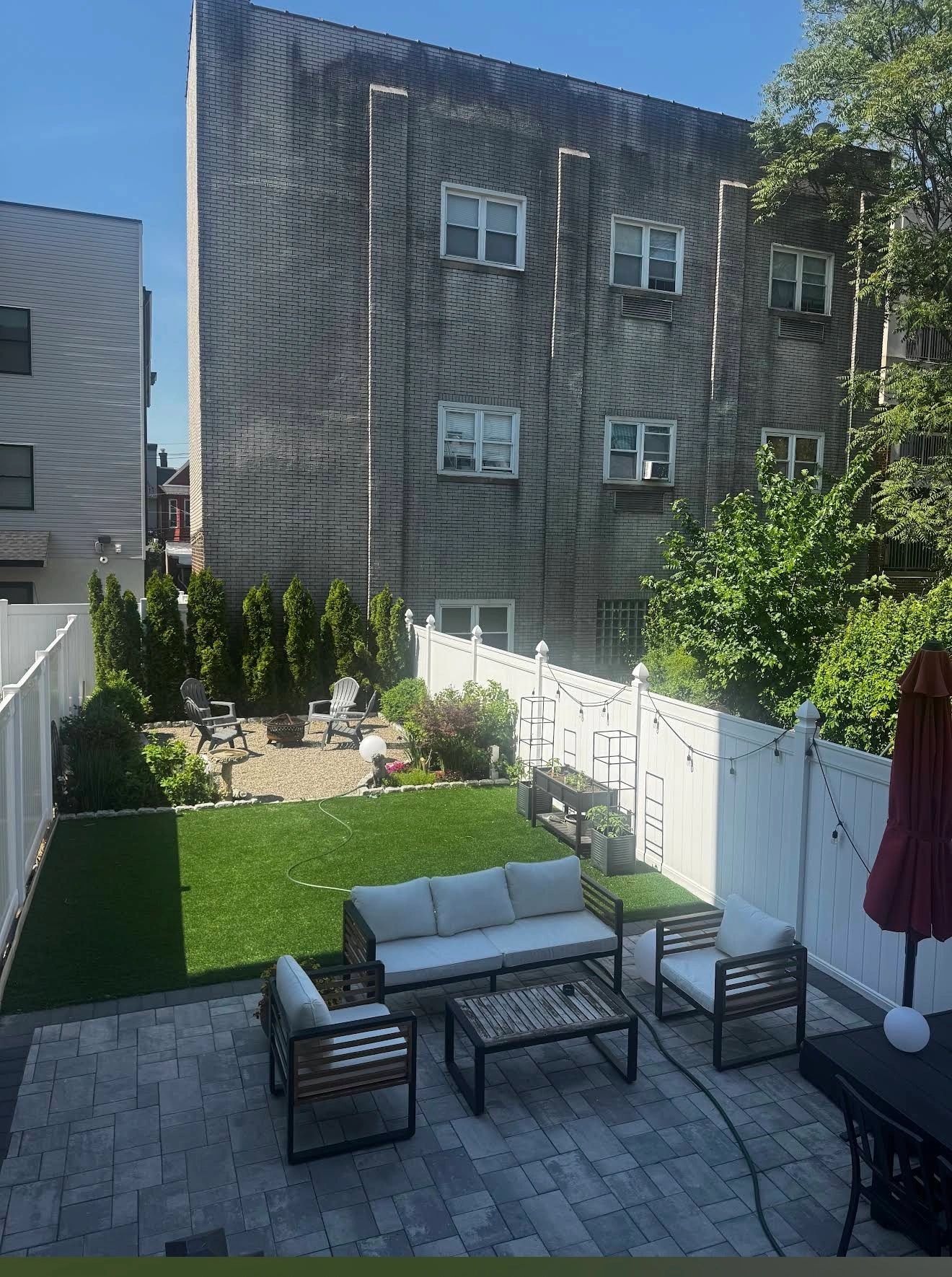 Modern backyard patio with seating area — Bergen County NJ