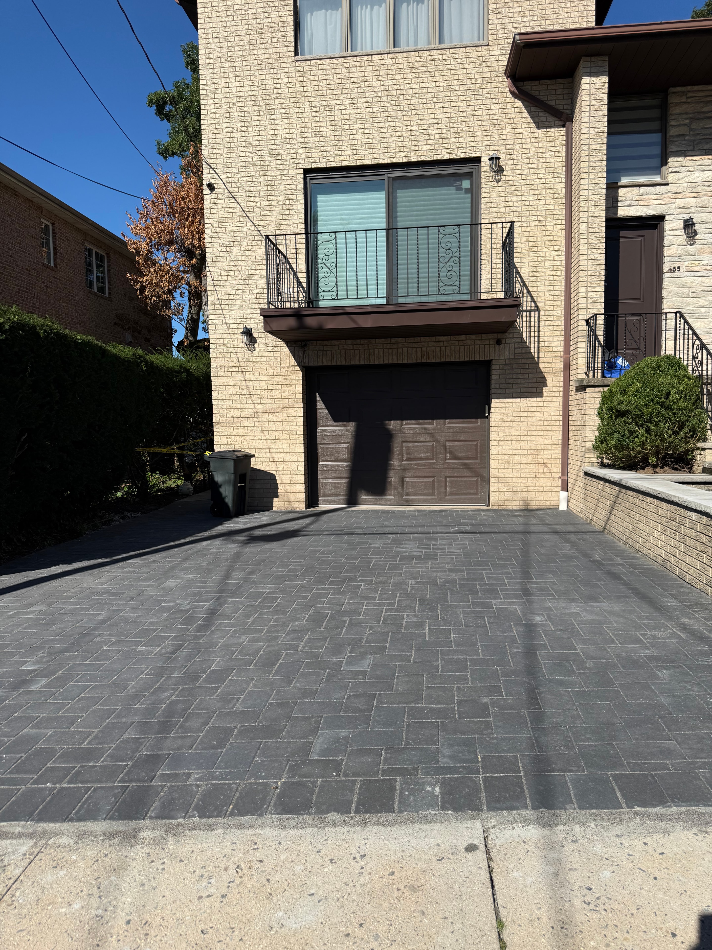 Completed charcoal paver driveway, full-width street-level view — Fort Lee, NJ — JKPOH Exterior Group