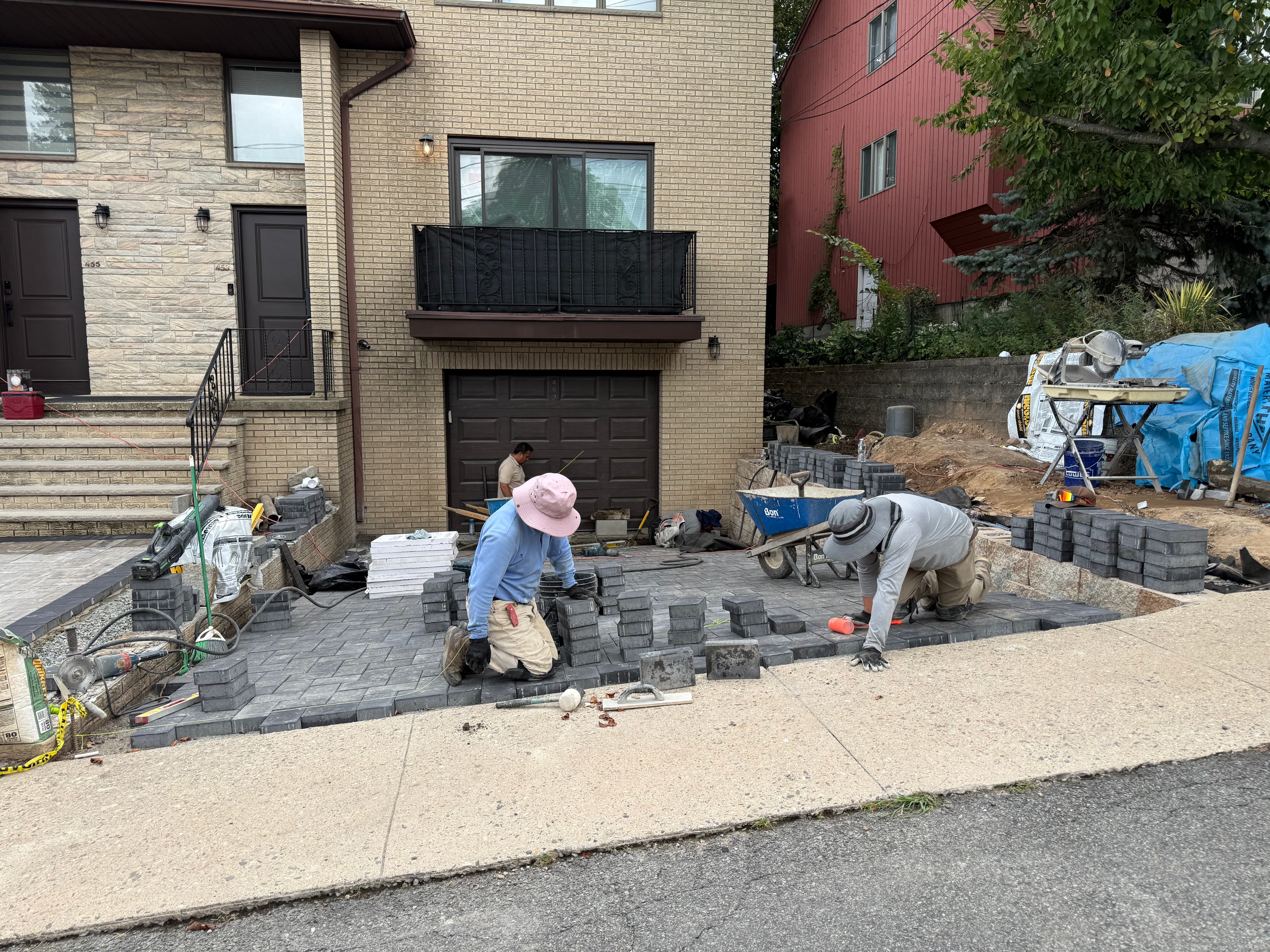 JKPOH Exterior Group crew installing driveway pavers with Belgian block border in Fort Lee, NJ