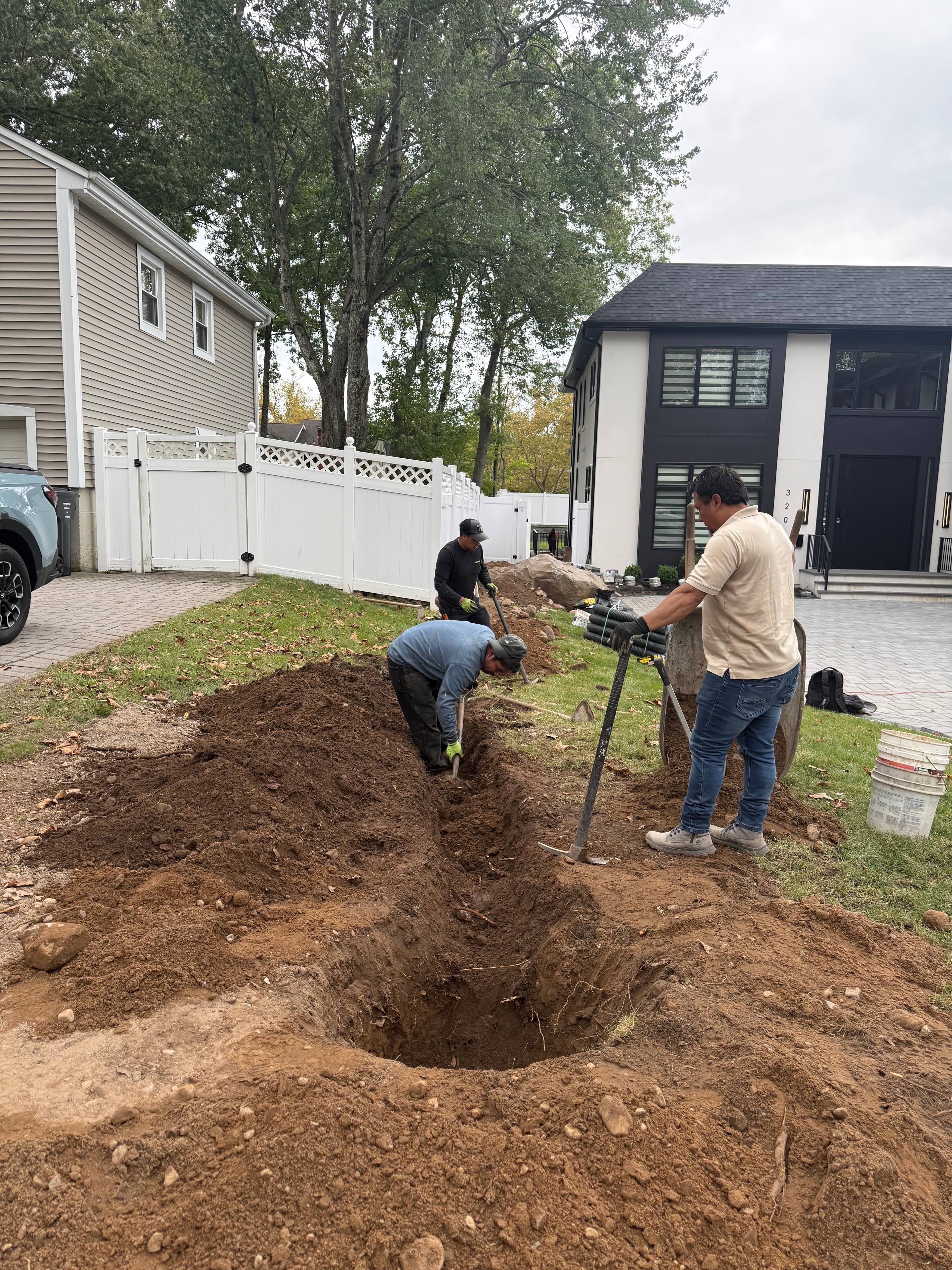 Wide view of drainage excavation trench at a residential property in Paramus, NJ — work in progress